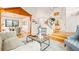 Spacious living room with hardwood floors, a staircase, and a dining area at 4534 Palmer Ct, Longmont, CO 80503