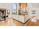 Inviting living room boasts a cozy atmosphere with beautiful hardwood floors, fireplace, and an abundance of natural light at 4534 Palmer Ct, Longmont, CO 80503