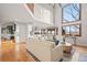 Open-concept living space with hardwood floors, high ceilings, abundant natural light, and seamlessly integrates with the kitchen at 4534 Palmer Ct, Longmont, CO 80503