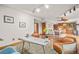 Office with wood floors connects to open living room and bar at 4534 Palmer Ct, Longmont, CO 80503