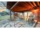 Cozy covered patio area with comfortable seating and access to the backyard at 4534 Palmer Ct, Longmont, CO 80503
