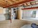 Unfinished basement featuring exposed ceiling beams, drywall walls, and various mechanical installations visible at 9406 Troon Village Way, Lone Tree, CO 80124