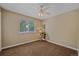 Cozy bedroom features soft natural light from the large window at 9406 Troon Village Way, Lone Tree, CO 80124