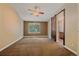Spacious bedroom with a barn door leading to ensuite bathroom at 9406 Troon Village Way, Lone Tree, CO 80124