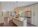 Modern kitchen with granite countertops, stainless steel appliances and wood flooring at 9406 Troon Village Way, Lone Tree, CO 80124