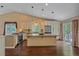 Bright, open kitchen with stainless appliances, large island and backyard access at 9406 Troon Village Way, Lone Tree, CO 80124