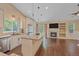 Open-concept kitchen boasts granite countertops, stainless appliances, and access to the outdoor patio at 9406 Troon Village Way, Lone Tree, CO 80124