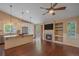 Open-concept kitchen boasts granite countertops, stainless appliances, and access to the outdoor patio at 9406 Troon Village Way, Lone Tree, CO 80124
