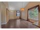 Bright living room with beautiful hardwood floors, high ceiling, and a stylish chandelier at 9406 Troon Village Way, Lone Tree, CO 80124
