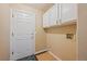 Mud room with a closet and laundry hookups is perfect for keeping things organized at 9406 Troon Village Way, Lone Tree, CO 80124