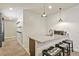 Stylish wet bar area featuring a sink, granite countertops, and seating for three at 21376 E Union Pl, Aurora, CO 80015