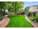 Large backyard with a deck and brick walkways at 19229 E Legend Ave, Parker, CO 80134