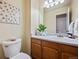 Clean bathroom with wood vanity and updated fixtures at 19229 E Legend Ave, Parker, CO 80134