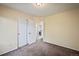 Bedroom with double doors and carpet flooring at 19229 E Legend Ave, Parker, CO 80134