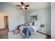Relaxing bedroom with light blue walls and a comfortable bed at 19229 E Legend Ave, Parker, CO 80134