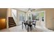 Bright dining room with a table and chairs near sliding doors to deck at 19229 E Legend Ave, Parker, CO 80134