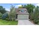 Green two-story house with attached garage and landscaped yard at 19229 E Legend Ave, Parker, CO 80134