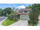 Green two-story house with porch, landscaped yard, and driveway at 19229 E Legend Ave, Parker, CO 80134