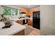 Bright kitchen with wood cabinets, white countertops, and black appliances at 19229 E Legend Ave, Parker, CO 80134