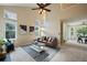 Open living room with vaulted ceiling, fireplace, and neutral decor at 19229 E Legend Ave, Parker, CO 80134