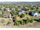 An aerial view of a landscaped neighborhood with mature trees and well-maintained lawns at 3163 Soaring Eagle Ln, Castle Rock, CO 80109