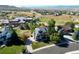 Aerial view of the home showcasing its location in a neighborhood near a school and green fields at 3163 Soaring Eagle Ln, Castle Rock, CO 80109