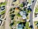 An overhead view of a well-maintained home with a large yard surrounded by trees in a suburban neighborhood at 3163 Soaring Eagle Ln, Castle Rock, CO 80109