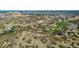 Aerial view of the community amenities, showing the park, playground, and activity areas in a natural setting at 3163 Soaring Eagle Ln, Castle Rock, CO 80109