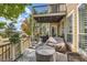 Inviting back deck with cozy seating areas, barbecue grill and views of open landscape at 3163 Soaring Eagle Ln, Castle Rock, CO 80109