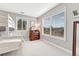 Bright bedroom featuring large windows, neutral walls, and a bunk bed at 3163 Soaring Eagle Ln, Castle Rock, CO 80109