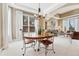 Elegant dining room with tray ceiling, chandelier, and views to the outside at 3163 Soaring Eagle Ln, Castle Rock, CO 80109