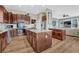 Modern kitchen with stainless steel appliances, hardwood floors, and two islands at 3163 Soaring Eagle Ln, Castle Rock, CO 80109