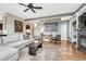 Spacious living room featuring a comfortable sofa, stylish decor, and hardwood flooring at 3163 Soaring Eagle Ln, Castle Rock, CO 80109