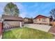View of the backyard and detached garage at 1418 Perry St, Denver, CO 80204