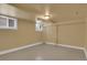Basement area with small windows and neutral paint color at 1418 Perry St, Denver, CO 80204