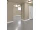 Finished basement space featuring an arched doorway and a white door at 1418 Perry St, Denver, CO 80204