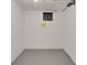 Clean, unfinished basement space with painted walls and floor, offering potential for customization at 1418 Perry St, Denver, CO 80204