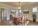 Formal dining room features a wooden table with seating for six and natural light at 1418 Perry St, Denver, CO 80204