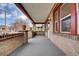Covered brick porch with room for seating at 1418 Perry St, Denver, CO 80204