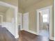 Hallway with hardwood floors with access to bathroom at 1418 Perry St, Denver, CO 80204