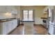 Spacious kitchen with an island, stainless steel appliances, and plenty of natural light at 1418 Perry St, Denver, CO 80204