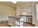 Bright kitchen featuring an island with storage, modern appliances, and ample cabinet space at 1418 Perry St, Denver, CO 80204