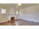 The living room features hardwood floors, an ornate fireplace, and bright natural light at 1418 Perry St, Denver, CO 80204