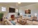 Cozy living room featuring a fireplace, large windows, and comfortable seating at 1418 Perry St, Denver, CO 80204