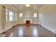 The living room features hardwood floors, an ornate fireplace, and bright natural light at 1418 Perry St, Denver, CO 80204