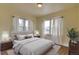 Bright bedroom with soft natural light from large windows and hardwood floors at 1418 Perry St, Denver, CO 80204