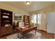 Bright office space featuring hardwood floors, large window and lots of storage at 1418 Perry St, Denver, CO 80204