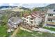 Aerial view of a beautiful home with mountain views and a large deck, perfect for outdoor entertaining at 415 Butte Pkwy, Golden, CO 80403