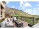 Scenic back deck with comfortable seating and a beautiful view of the hillside at 415 Butte Pkwy, Golden, CO 80403