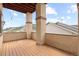 Spacious balcony with wood decking and scenic mountain views, ideal for enjoying the outdoors at 415 Butte Pkwy, Golden, CO 80403